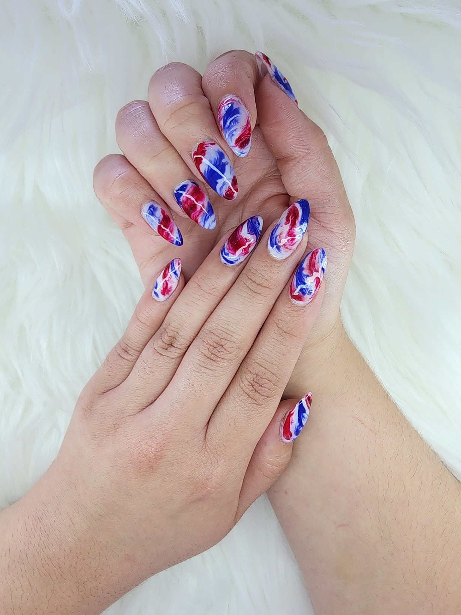 Red, white, and blue marbled nail art